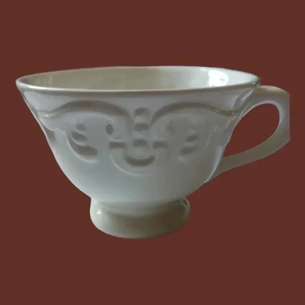 Shabby chic porcelain teacup and saucer